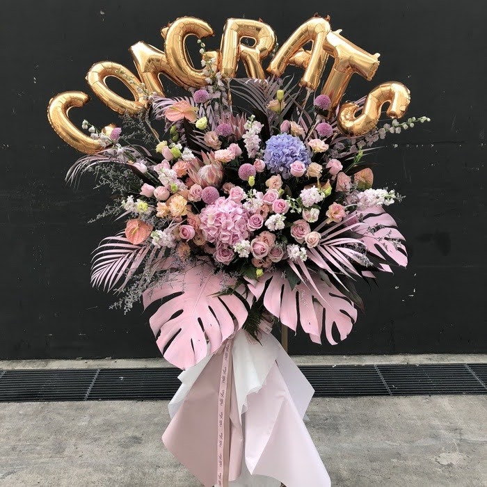 pink congratulatory flower stand
